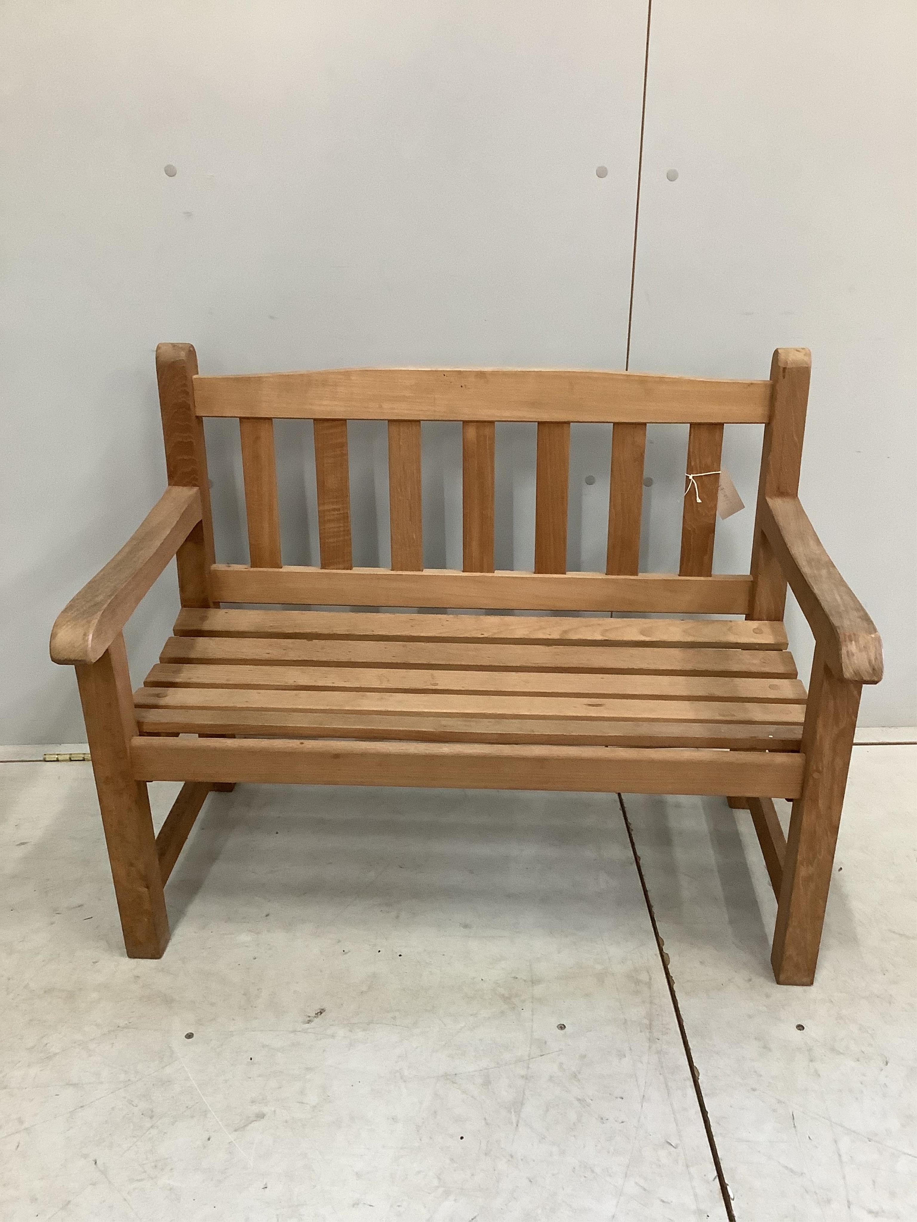 A child's teak garden bench, width 86cm, depth 47cm, height 68cm. Condition - good